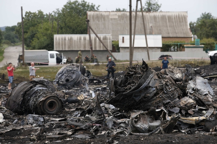 Debris is seen at the site of Thursday's Malaysia Airlines Boeing 777 plane crash near the settlement of Grabovo, in the Donetsk region